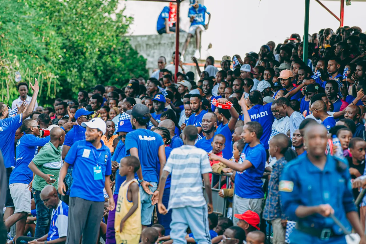 Sports supporters cheering together in the stands